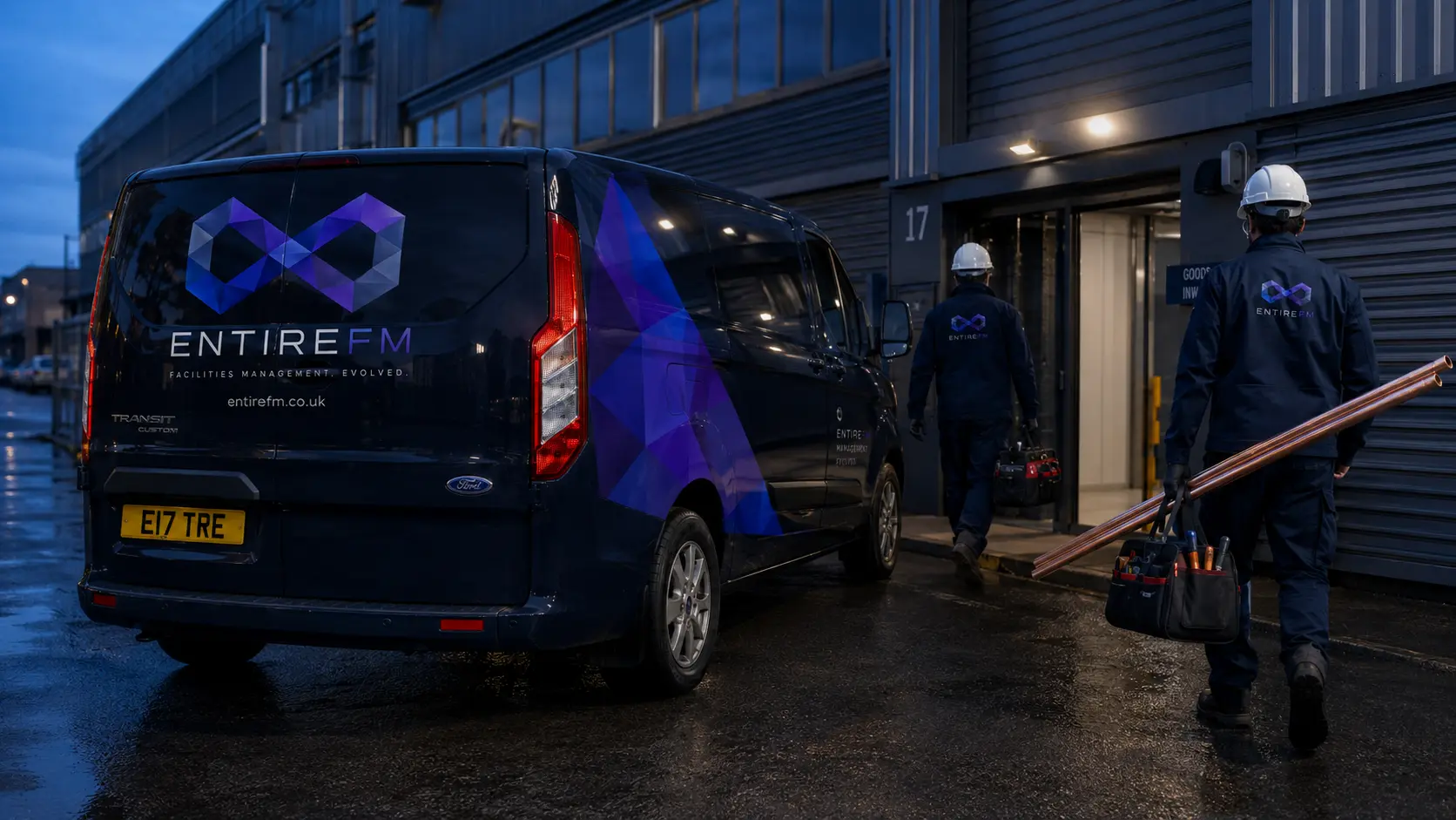 Commercial drainage engineer arriving on commercial facility with high-pressure jetting and survey van